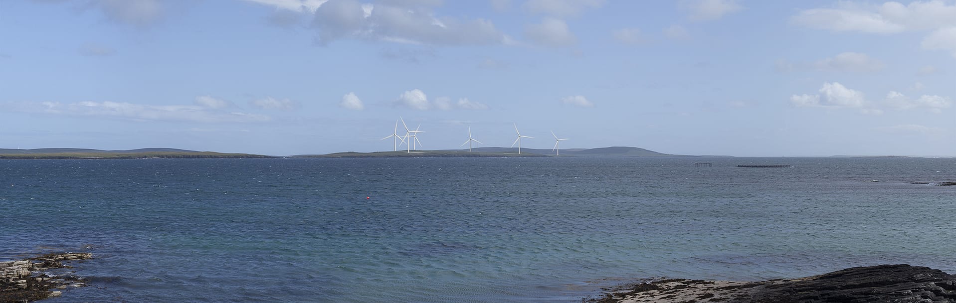 View from Westray Ferry Terminal to Faray Wind Farm.